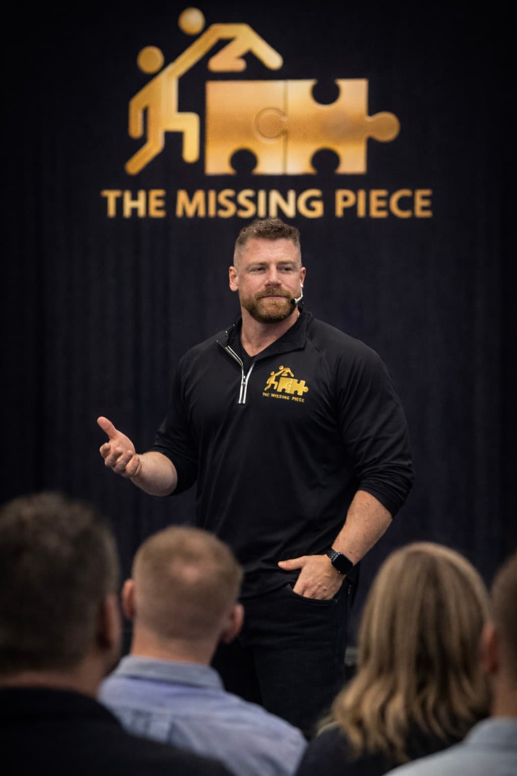 Alistair Johnstone on stage — The Missing Piece lifestyle coach